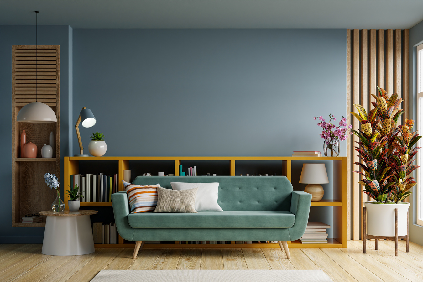 Empty living room with green sofa on empty dark blue wall.